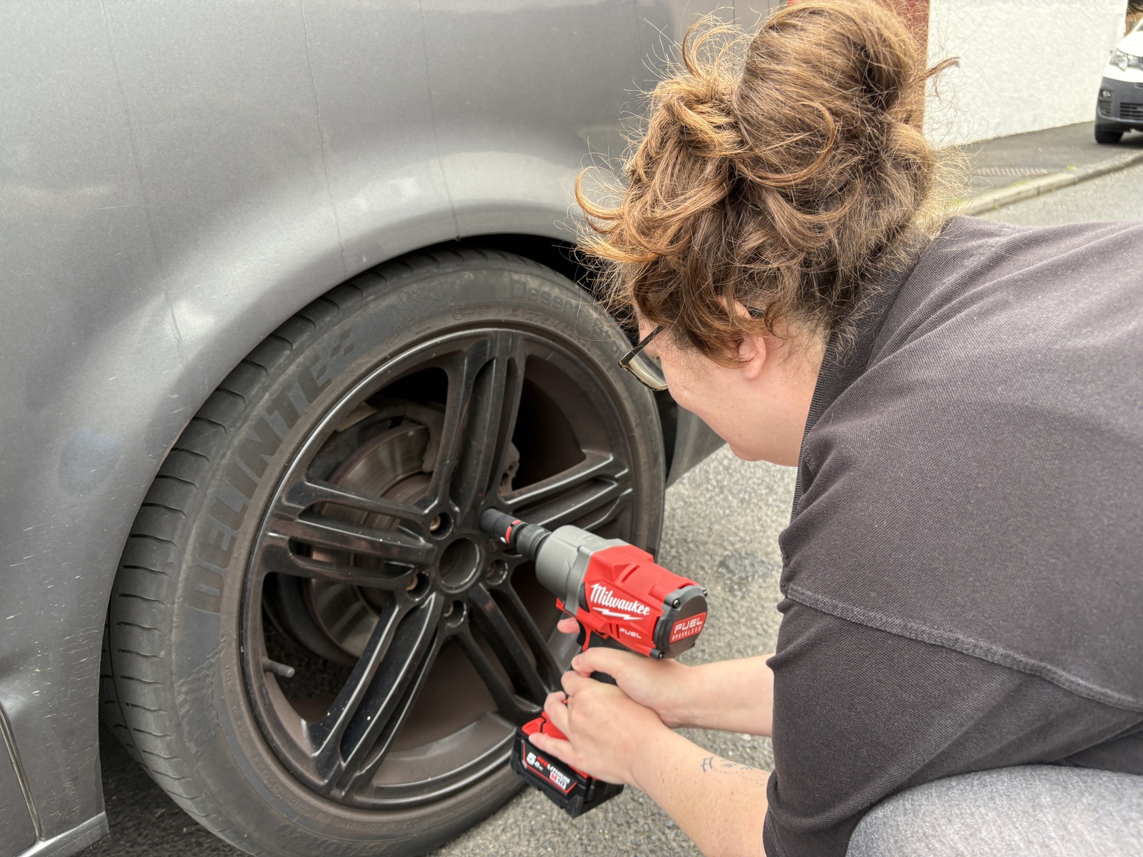 Torque wrench being used on a wheel during the Van 001 build